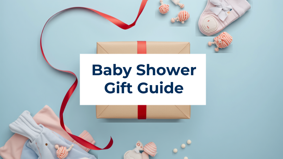 Baby shower gift guide banner featuring a wrapped organic cotton baby gift box with a red ribbon on a soft blue background