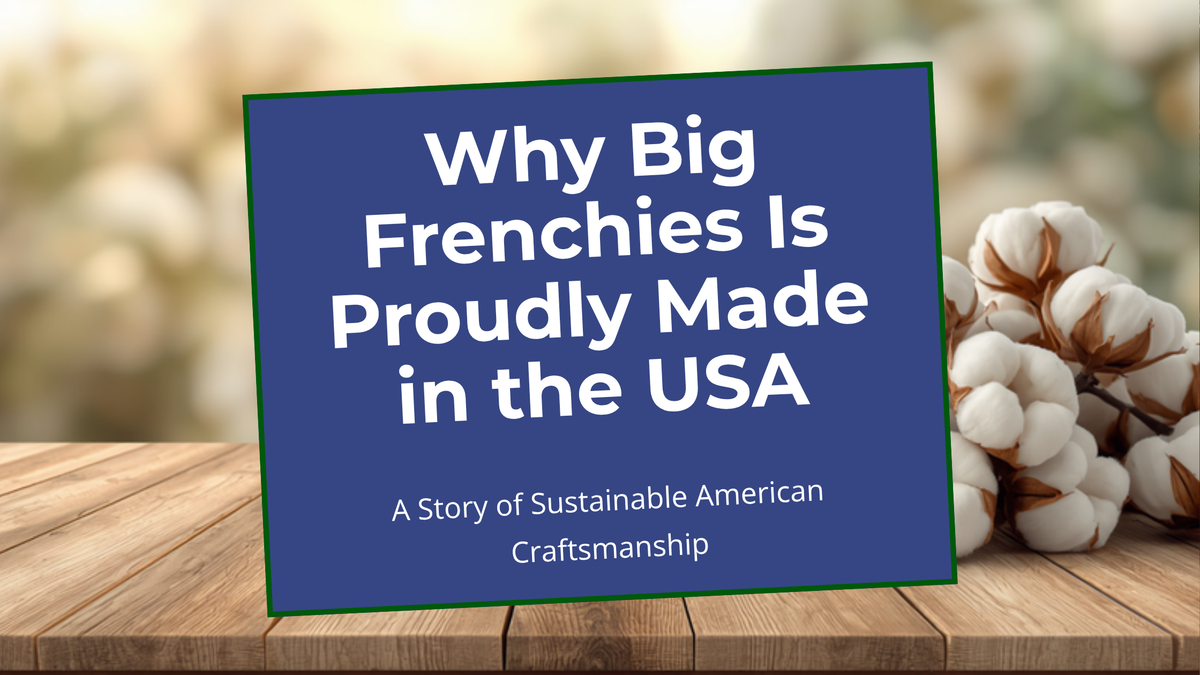 Blog header for Why Big Frenchies Is Proudly Made in the USA, centered navy title card on a wooden table with cotton bolls