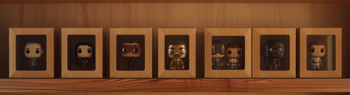 Framed Funko Pop vinyl figures displayed in wooden shadow-box frames on a shelf