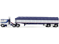 Peterbilt 352 COE 110" Sleeper and 53' Wilson Roadbrute Flatbed Trailer with Covered Wagon White with Blue Stripes 1/64 Diecast Model by DCP/First Gear