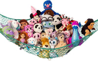 Lilly's Love white macrame stuffed animal hammock hanging in a bedroom corner - view 2