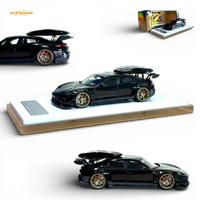 404ERROR Porsche Taycan Black with Roof Box 1:64
