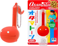 Otamatone Melody musical electronic instrument toy keychain in lime green note shape