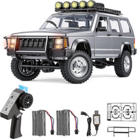 Goolsky silver 1:12 scale RC rock crawler with LED lights on rocky ground - view 2