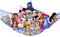 Lilly's Love white macrame stuffed animal hammock hanging in a bedroom corner - view 3