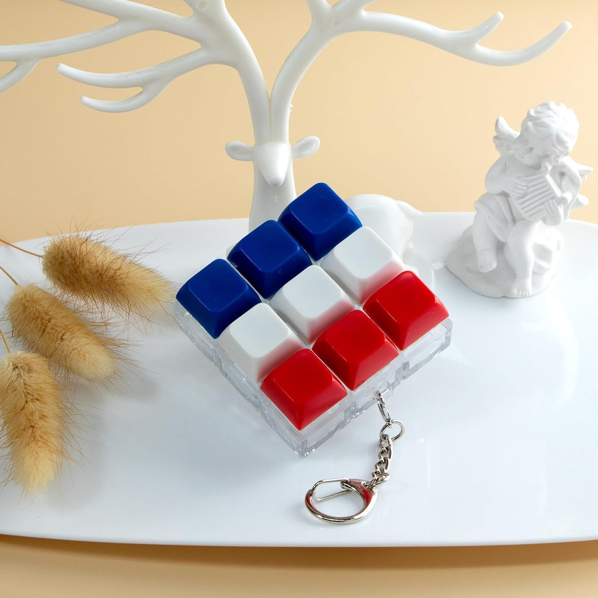 XiawaLangzhuo cat paw keyboard fidget toy, 9-in-1 clicker keychain in white and purple - view 33