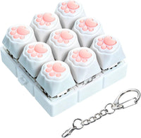 XiawaLangzhuo cat paw keyboard fidget toy, 9-in-1 clicker keychain in white and purple - view 3