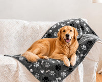 Grey waterproof dog blanket with bone and paw print pattern, 40 by 30 inches