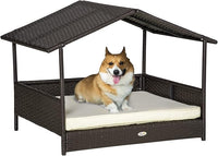 PawHut Wicker Dog House Outdoor with Canopy, Rattan Dog Bed with Water-Resistant Cushion, Raised Dog Bed for Small, Medium Dogs up to 66 lbs, 19.75" in Length, Brown Wicker, White Cushion
