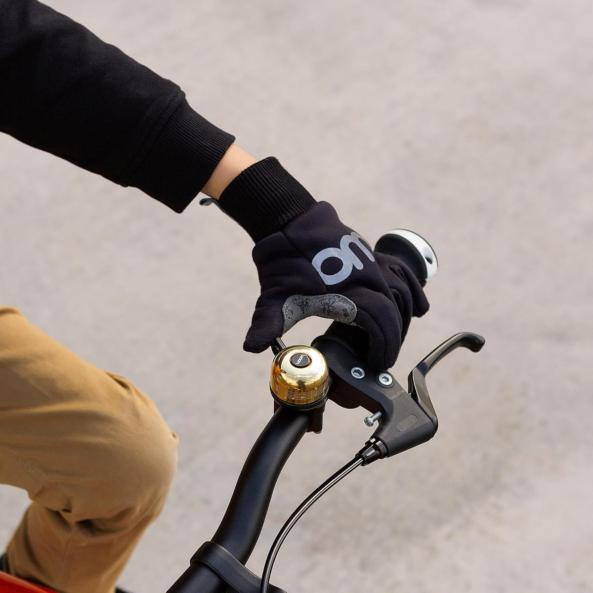 woom VIENNA kids bike bell in brass mounted on a children's bike handlebar - view 8