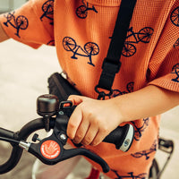 woom VIENNA kids bike bell in brass mounted on a children's bike handlebar - view 5