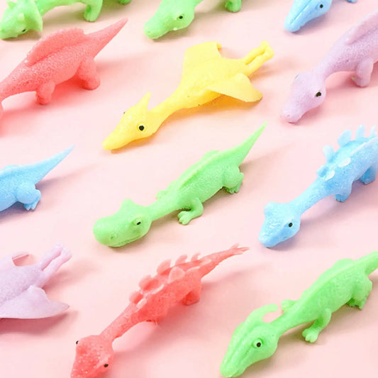 MEACAOFG 10 Pcs Slingshot Dinosaurs Finger Toys | Rubber Dinosaur Slingshot Toy Flicking Slingshot Dinosaur Finger Toys | Stretchy Flying Dinosaur | Sensory Fidget Toys | Novelty Gifts For Adults