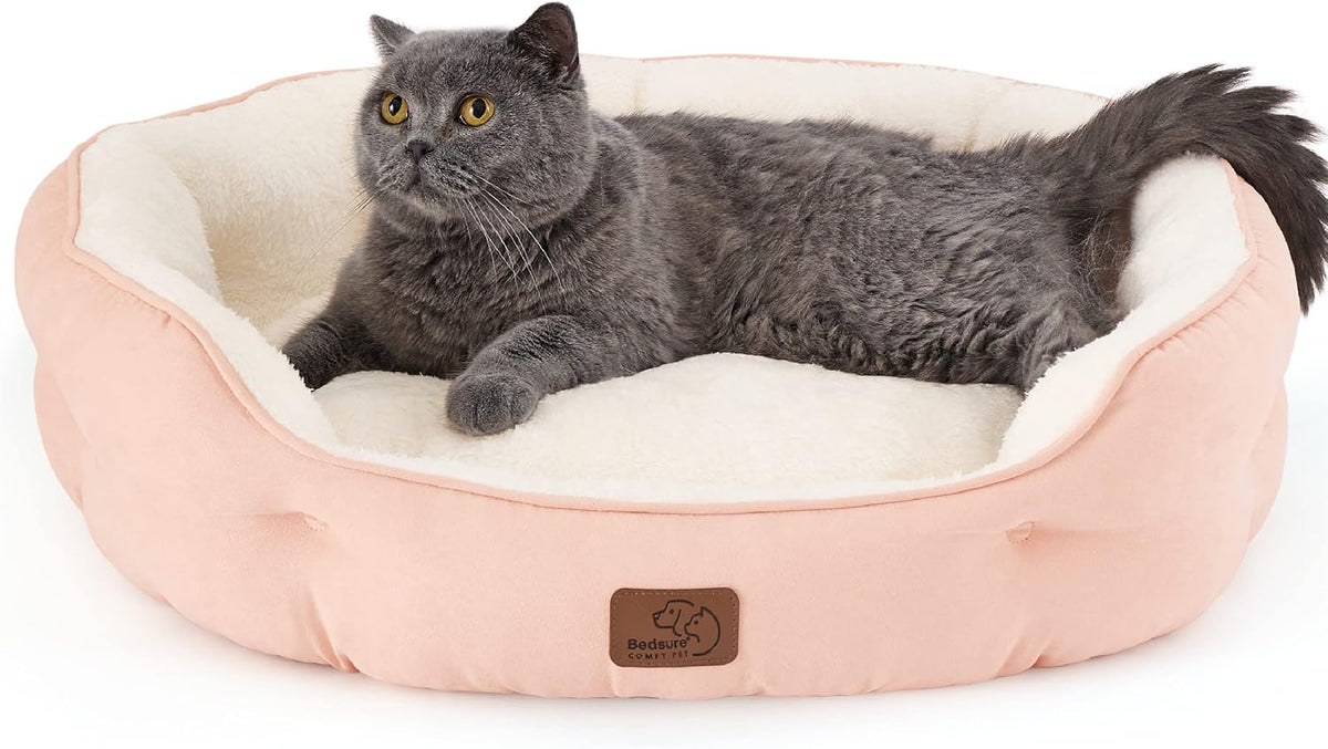 Bedsure Small Dog Bed Washable, Round Cat Beds for Indoor Cats - 25"L x 21"W x 8"Th / Peach Pink