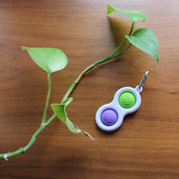 Fat Brain Toys Simpl Dimpl popping fidget keychain in Purple/Lime with silicone bubbles - view 3