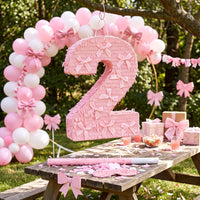 Feifeiya pink bow piñata with pink and white bat, eye masks and confetti - view 25
