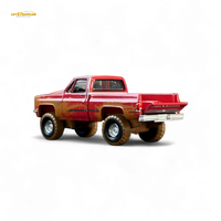 Auto World 1983 Chevrolet Silverado K10 4x4 Muddy Lifted 1:64