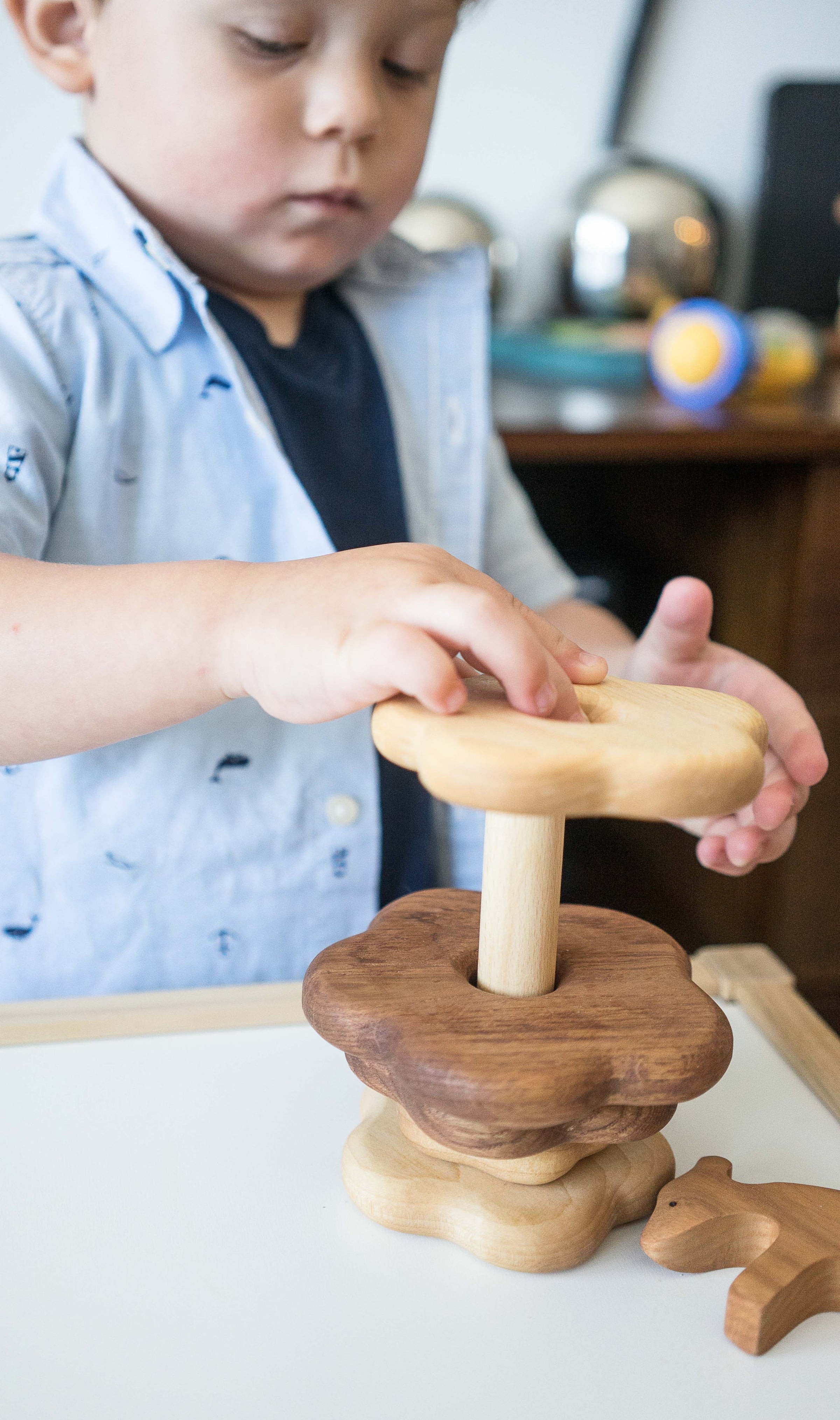 Wooden stacking toy in flower shape from 2 types of wood